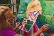 © tomas del amo - female artist painting a self portrait