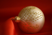 Gold Christmas Ball On Red  Background