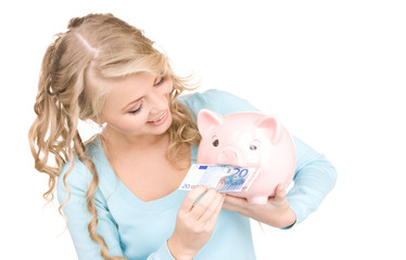 lovely woman with piggy bank and money