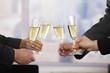© nyul - Business people celebrating with champagne