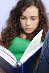 teenage girl reading a book