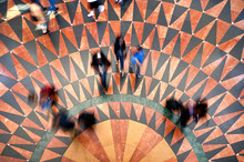 Overhead Shot Of Commuters Walking On Geometrical Tile Pattern At Union Station In Los Angeles During Rush Hour