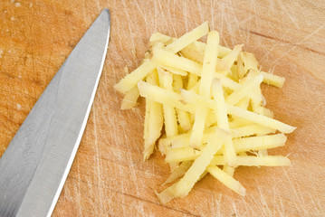 Wall Mural - Sliced Ginger Root on a Cutting Board