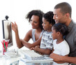 © WavebreakMediaMicro - Afro-American family working with a computer at home