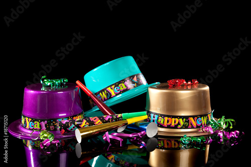 New years eve hat and noisemakers on black Poster