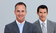 © WavebreakMediaMicro - Portrait of smiling businessmen with folded arms
