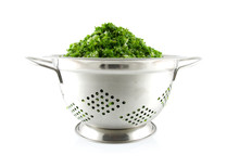 Colander With Fresh Kale Over White Background