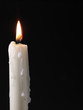 © Dmytro Tolokonov - Burning candle over black. Is not isolated, just shot on black