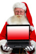 © Emin Ozkan - santa holding a laptop