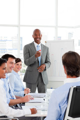 Wall Mural - Confident Afro-American businessman discussing with his team