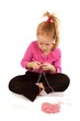 Little girl knitting