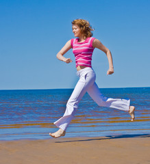 Canvas Print - Active girl on a beach