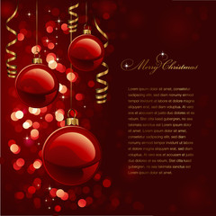 christmas background with red baubles and defocused lights
