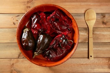 Wall Mural - Eggplant and peppers roasted on clay vessel