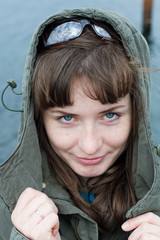 Portrait of attractive young woman in hood