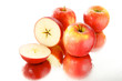 przekojone jabłko na lustrze, group of apples, białe tło