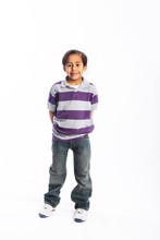 Child Standing Alone In Casual Clothes Isolated
