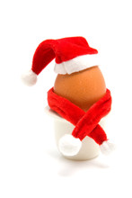 Decorated Christmas Egg In Holder Over White Background
