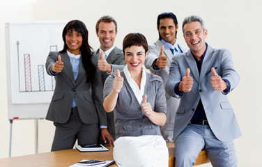 Wall Mural - Successful business people with thumbs up