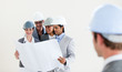 © WavebreakMediaMicro - Male Engineer looking back at his smiling colleagues