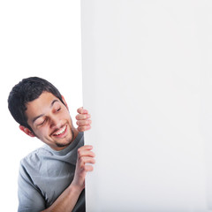 Man standing behind and looking at blank white board