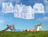 Fototapeta  - lying couple on grass and dream three cloud houses collage