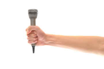 Hand and arm holding microphone isolated on white