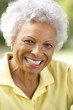 © Monkey Business - Portrait Of Smiling Senior Woman Outdoors