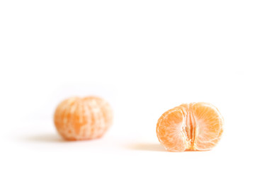 Two peeled mandarin