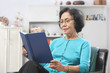 © Arto - Senior woman reading book