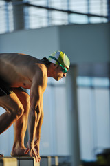 Wall Mural - young swimmmer on swimming start