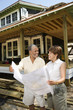 © iofoto - Couple Holding Building Plans