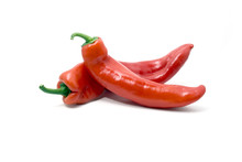 Two Red Sweet Pointed Peppers On White Background