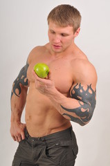 Bodybuilder with an apple