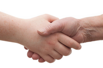 Diversity - young and old females shaking hands