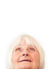 Wall Mural - Older woman looking up at copyspace