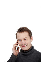 Wall Mural - Friendly modern young guy talking on mobile phone