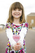 © BCFC - Adorable child holding candy heart shape with love message
