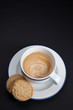 Coffee  and cookies on black background
