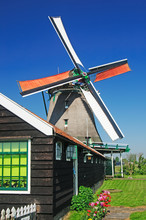 Dutch Windmill On A Blue Sky Background