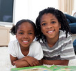© WavebreakMediaMicro - Close-up of siblings reading