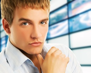 Wall Mural - Handsome young business man over abstract background .