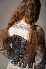 Woman In Medieval Corset And Shirt