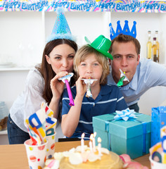 Wall Mural - Jolly parents celebrating their son's birthday