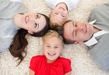 Wall Mural - Merry family lying on the floor