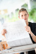 © EastWest Imaging - Woman with Newspapers