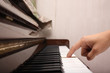 playing piano with one finger