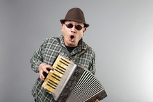 Man Playing A French Accordion