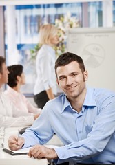 Sticker - Businessman making notes on meeting