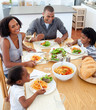 © WavebreakMediaMicro - Happy african american family dining together